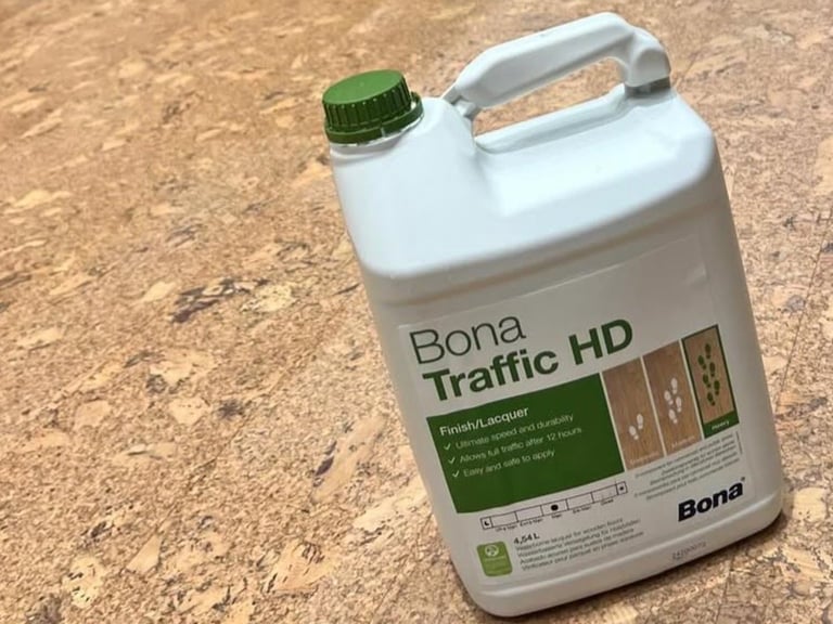 Bona Traffic HD floor finish in a white plastic jug with green cap and handle on a concrete surface